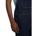 Dark blue denim overalls worn by a person on a white background