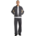 Man wearing a gray jacket with white accents and dark pants on a white background