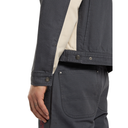 Dark gray jacket with beige shirt and pocket detail on a white background
