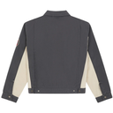 Back view of a dark gray denim jacket with beige sleeves on a white background