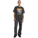 Man wearing a graphic t-shirt and pants on a white background