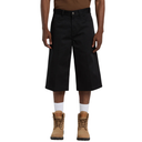 Person wearing black pants and tan boots on a white background