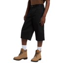 Person wearing black shorts and tan boots on a white background