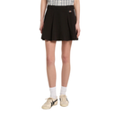 Person wearing a black pleated skirt on a white background