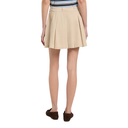 Beige pleated skirt worn by a person on a white background