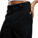 Close-up of a person wearing black high-waisted trousers, showing the waistband, belt loop, front pocket, and hand at the side, against a plain white background.