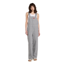 A model wearing gray and white vertically striped corduroy bib overalls over a white tank top and beige sandals, photographed against a solid white background.