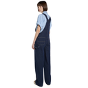 Person wearing blue denim overalls on a white background