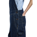 Person wearing a blue denim apron over a light blue striped shirt on a white background