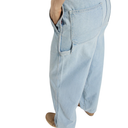 Light blue jeans worn by a person on a white background