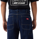 Rear view of a person wearing dark blue Dickies jeans and a black t-shirt with white text, against a white background.