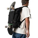 Person carrying a black backpack with a skateboard attached to it on a white background