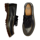 Black leather loafers with tassels on a white background