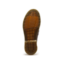 The outsole of a brown leather boot, showing a textured tread pattern and embossed branding, isolated on a white background.
