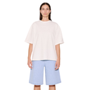 Person wearing a white oversized t-shirt and light blue shorts on a white background