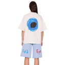 Person wearing a white t-shirt with a blue circular design on the back and light blue shorts with text.