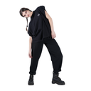 Person wearing a black outfit with a white background