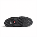 The black rubber outsole of a shoe, showing detailed tread patterns and a small red and white Salomon logo on the heel, photographed against a solid white background.