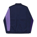 A navy blue track jacket shown from the back, featuring contrasting light purple and dark purple sleeve panels, on a solid white background.