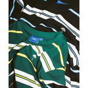 Green striped shirt with a brand label on a white background