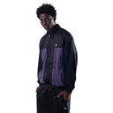 A man wearing a black and purple color-blocked windbreaker jacket with matching black track pants, posed against a solid white background.