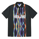 Black polo shirt with colorful flame pattern and 'HELAS' branding on a white background