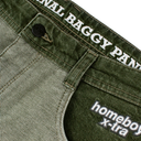Close-up of olive green denim shorts showing the waistband with white embroidered text reading 'FINAL BAGGY PANTS' and the leg patch reading 'homeboy x-ira'.