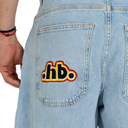 Light blue denim jeans with a colorful logo on the back pocket against a white background