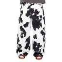 Cow print pants on a white background