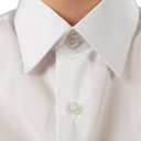 Close-up of a white shirt with a collar and buttons on a light gray background