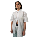 Person wearing a white shirt with a pocket on a white background