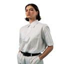 Woman wearing a white shirt with decorative pocket on a white background