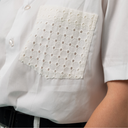 White shirt with a lace pocket detail