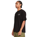 Man wearing a black t-shirt with a logo on a white background