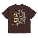 A dark brown short-sleeve t-shirt shown from the back, featuring a graphic print of a hand in white outline with the word 'DOOM' written vertically in yellow gothic font.