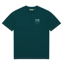 A dark teal green short-sleeve crewneck t-shirt with a small tonal graphic on the left chest, displayed flat against a solid white background.