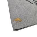 Close-up of a folded heather gray garment, likely sweatpants or shorts, showing a small gold embroidered logo on the leg and a dark drawstring at the top edge, photographed on a white background.