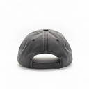 A dark gray washed baseball cap viewed from the back, resting on a white surface with a light gray background.