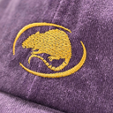 Close-up of a purple textured fabric with a yellow embroidered mouse inside a circular outline.