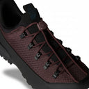 Maroon and black sneaker with textured pattern on a white background