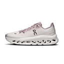 White and pink running shoe with unique sole design on a white background