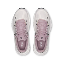 White running shoes with pink accents on a white background