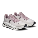 Pair of white and pink running shoes on a white background