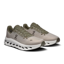 Pair of beige running shoes with white soles on a white background