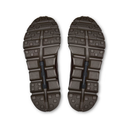 A pair of rugged outdoor shoe soles shown from the bottom, featuring a dual-tone design with olive green textured lugs and black central tread blocks, photographed on a clean white background.