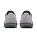 Gray athletic shoes with black soles on a white background