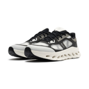 Black and white sneakers with a minimalist design on a white background