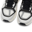 Close-up of a pair of black and white sneakers on a white background
