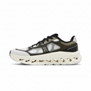 Black and white athletic shoe with 'On' branding on a white background