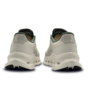 Pair of white running shoes with black soles on a white background